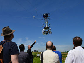 Almost like an air show: the phenotyping system’s sensor head hovers above the heads of spectators