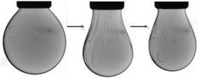 Squeezing nanocrystals in a liquid droplet into a solid-like state and back again