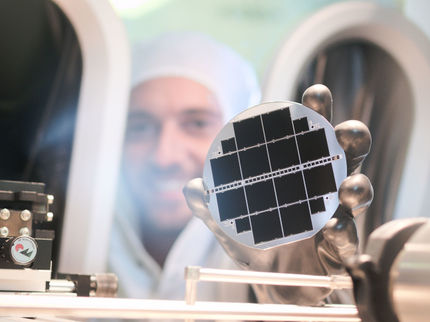 Two Records for the Efficiency of Silicon-Based Monolithic Triple-Junction Solar Cells