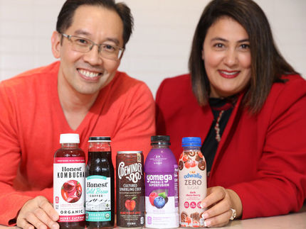 Simon Yeung, SVP, Innovation and Stewardship, Coca-Cola North America, and Susan Zaripheh, Transformational Innovation Team lead, with several of the brands their team has helped develop and commercialize.
