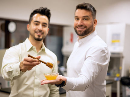 MeliBio Co-Founders: Aaron Schaller, PhD and Darko Mandich holding prototypes of MeliBio honey made without bees