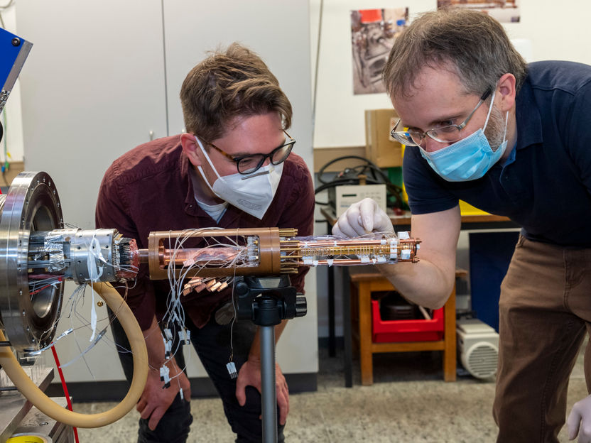 In the trap: New method for cooling charged particles - System consisting of two Penning traps connected to an electrical resonant circuit transmits the cooling power of laser-cooled ions