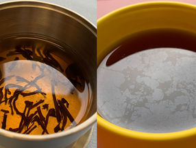 A thin film at the air-water interface is observable in a cup of tea.