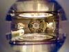 A deep view into the main vacuum chamber of the NaK molecule experiment. In the center, four high-voltage copper wires are led to an ultrahigh-vacuum glass cuvette in which the ultracold polar molecules were generated.