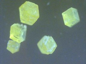 Missing atoms in a forgotten crystal bring luminescence