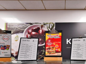 PACE labels alongside menus in a workplace cafeteria