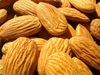 A handful of almonds could keep extra kilos at bay.
