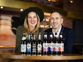 Catharina Cramer, owner of Warsteiner Group, and Tom Cronin, CEO of Rye River Brewing Company, toast the future collaboration.